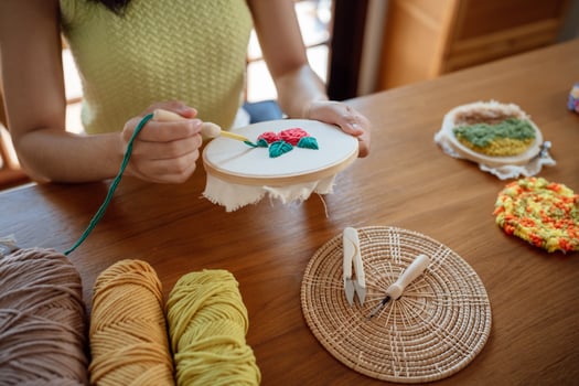 Punch needle. Asian Woman making handmade Hobby knitting in studio workshop. designer workplace Handmade craft project DIY embroidery concept. photo