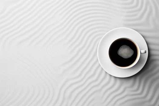 Aerial View of Steaming Coffee Cup on Geometrically Patterned Surface with Ample Copy Space photo