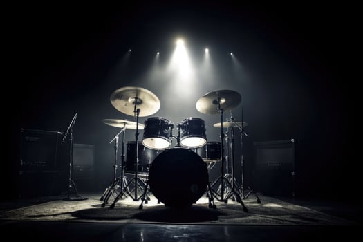 Drum set on stage for band with spot lighting spotlight, dark background. photo