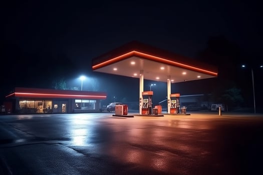 Gas station at night. Refueling of gasoline at gas station photo