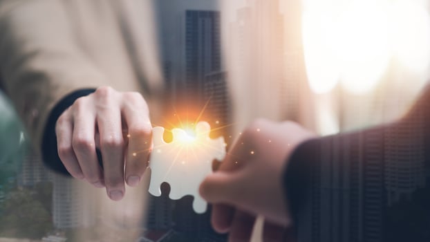 Businessman holding a puzzle piece to find a business solution ,Connecting success and problem solution from creativity ,strategic planning to develop organization ,success and strategy concept photo