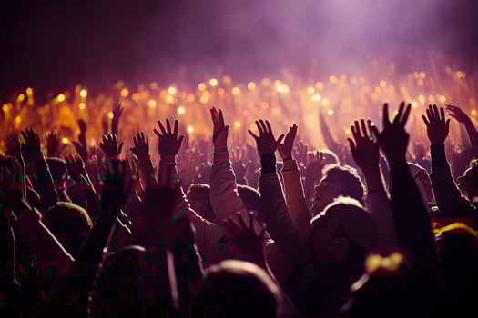 Concert crowd at a music festival, hands raised in the air. . photo