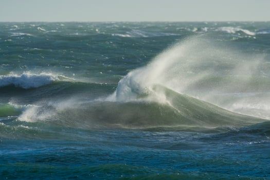 Waves with strong wind after a storm, Patagonia, Argentina. photo