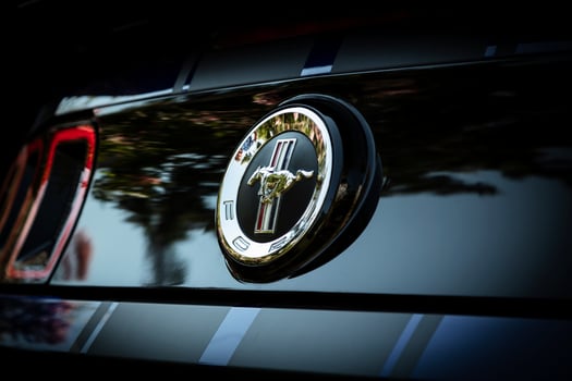 Blue Ford Mustang with black stripes, creative photoshoot. Commercial and advertising sports muscle car photography. photo