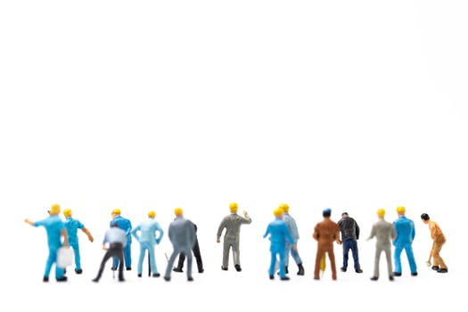 Miniature people , Worker team standing on white background, Labour day concept photo