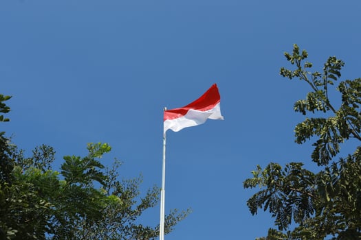 17 August 1945, Indonesian flag against sky background. Independence day concept photo