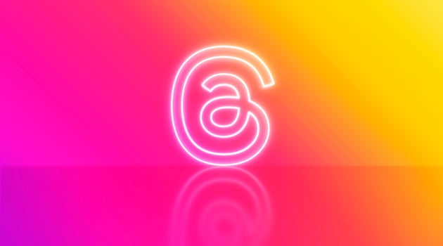 Madrid, Spain - July, 2023. Threads logo in neon on gradient background with space for text and graphics. photo