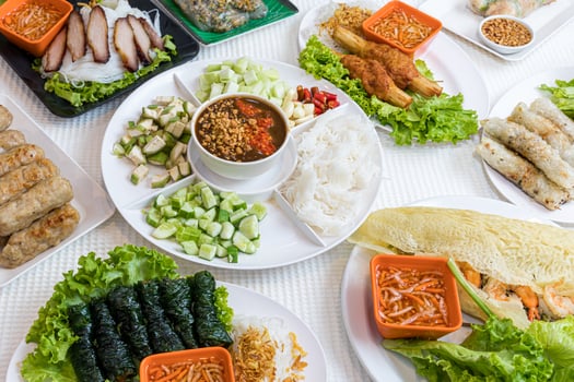 Assorted asian dinner, vietnamese food. Pho ga, pho bo, noodles, spring rolls, Nham due photo