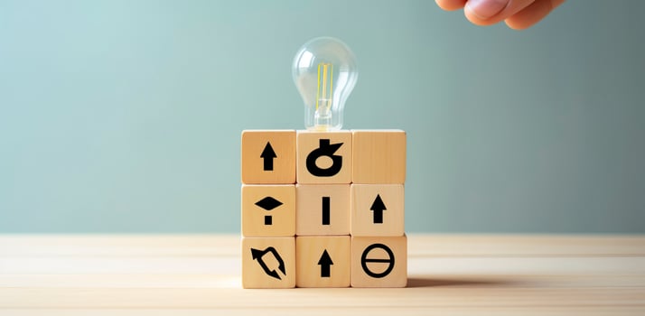 Creative idea, solution and innovation concept. Idea generation for business development. Wooden cube blocks with light bulb and cycle icons on clean background and copy space. photo