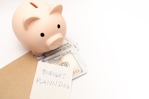 Money budget planning. Piggy bank with calculator and notebooks on white background, financial goal concept. photo