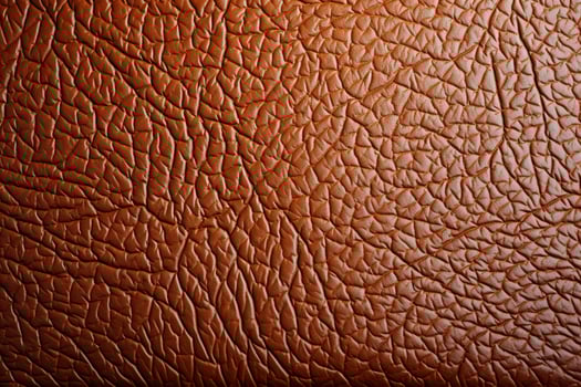 Rugged leather texture complementing a plain, unadorned surface photo