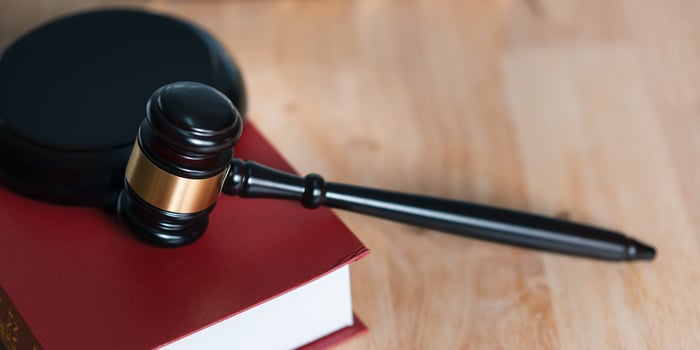 Wooden judge gavel on table ,justice in punishment of offenses and criminal verdicts ,concept of law and justice ,court proceedings ,planning for court proceedings ,legal contract consulting photo