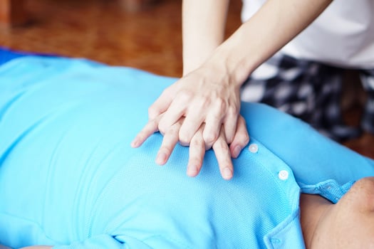 Close up hands  pump on chest for first aid emergency CPR of unconscious man. Concept, Heath care, life rescuse. CPR Cardiopulmonary Resuscitation. Heart pumping for unconscious person. photo