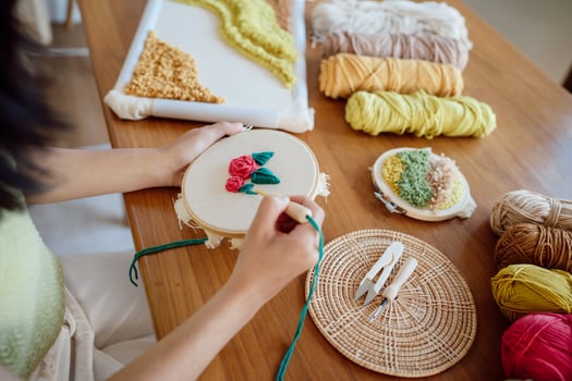 Punch needle. Asian Woman making handmade Hobby knitting in studio workshop. designer workplace Handmade craft project DIY embroidery concept. photo
