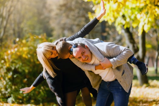 The family walks in the park in autumn photo