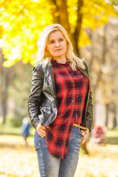 girl walks in the autumn park photo