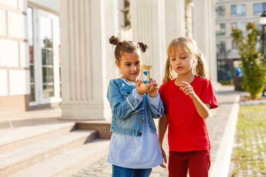 Portrait of happy fashion little girls having fun in the city photo