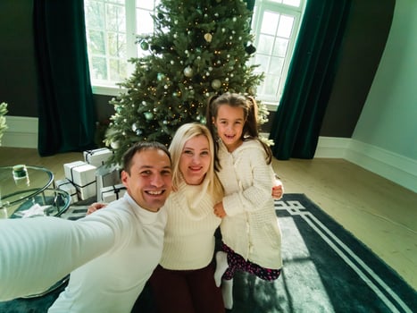 Portrait of friendly family on Christmas evening photo