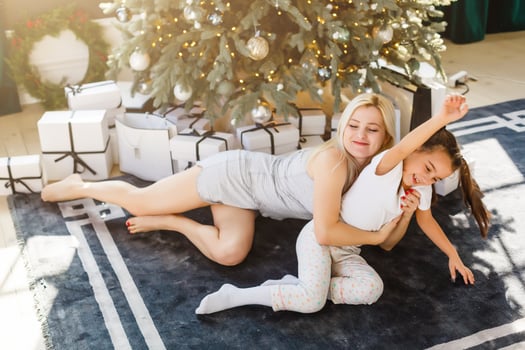 mom and daughter playing pajamas photo