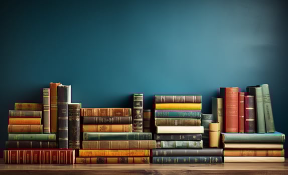 Literature-themed banner featuring a bookshelf, stack of hardcovered books, and copy space photo