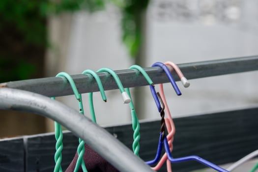 Old coat hangers of many colors photo
