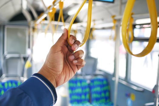 Hand holding handle on the public transport photo