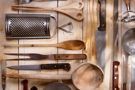 a bunch of different utensils on a table photo