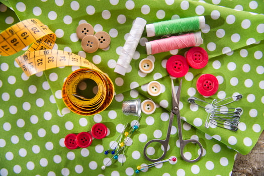 a pile of buttons on a white table photo