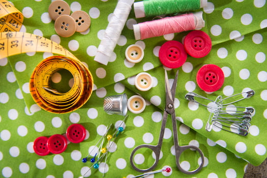 a pile of buttons on a white table photo