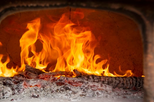 a close up of a fire burning in a fireplace photo