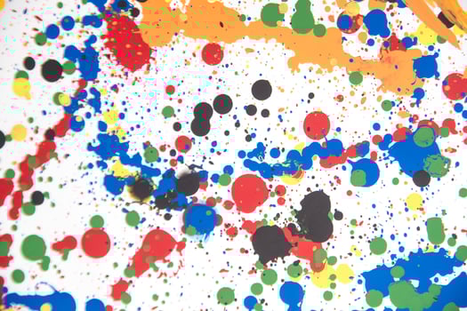 a colorful paint splattered surface with many different colors photo