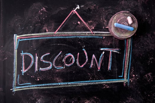 Written blackboard with discounts photo