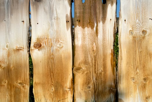 Fence made of wooden planks photo