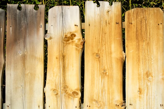 Fence made of wooden planks photo