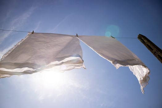 House linen hanging out in the sun photo