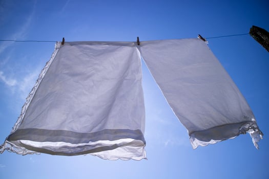House linen hanging out in the sun photo