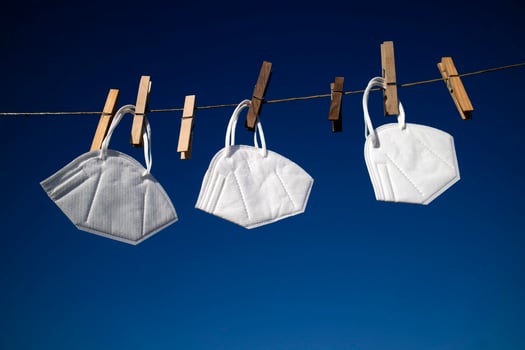 Coronavirus protection masks hung out to dry photo