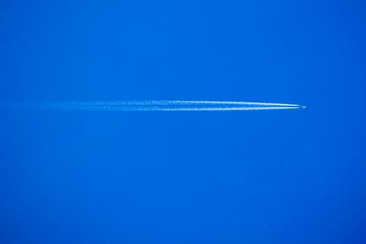 The trails in the sky that leave the planes in flight photo