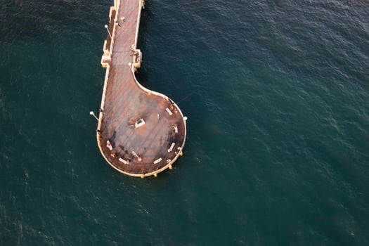 Aerial view at sunset of the pier in Marina di Massa Tuscany Italy photo