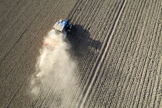 Aerial view of a tractor in the moment of sowing photo