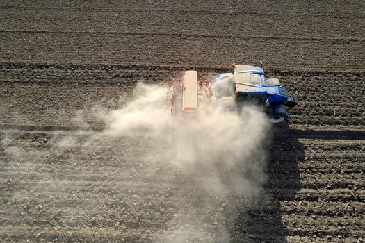 Aerial view of a tractor in the moment of sowing photo