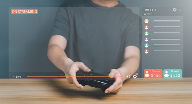 Gamer controlling joystick for Video Game With Live Chat And Donate. Streamer or creator broadcast play game, New technology trends, entertainment on virtual screen, Streaming content internet concept photo