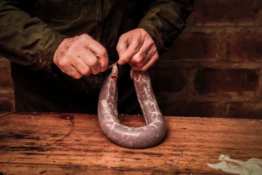 Hands making homemade sausages, Patagonia, Argentina photo