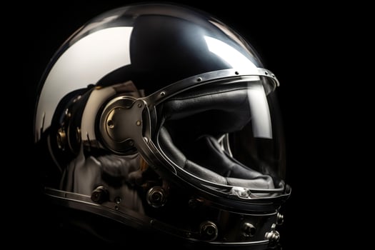Astronaut helmet detail with glossy glass and reflections on metal surface photo