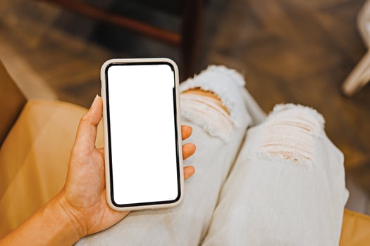 Women's hands holding cell telephone blank copy space screen. smartphone with blank white screen isolated on white background . smart phone with technology concept photo