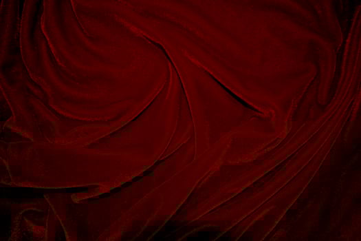 Red velvet fabric texture used as background. red panne fabric background of soft and smooth textile material. crushed velvet .luxury scarlet for silk. photo