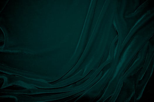 Green velvet fabric texture used as background. Peacock color panne fabric background of soft and smooth textile material. crushed velvet .luxury emerald tone for silk. photo