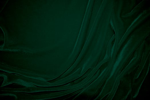 Green velvet fabric texture used as background. Emerald color panne fabric background of soft and smooth textile material. crushed velvet .luxury emerald tone for silk. photo