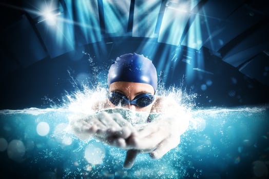 Sporty woman athlete swims with energy during a competition in the pool photo