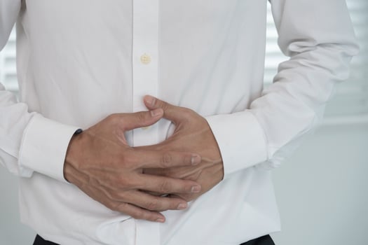 stomach ache. Asian men have abdominal pain, indigestion, gastritis, menstrual cramps, flatulence, diarrhea, distention, colon cancer, belly inflammation problem, suffer food poisoning, abdomen photo